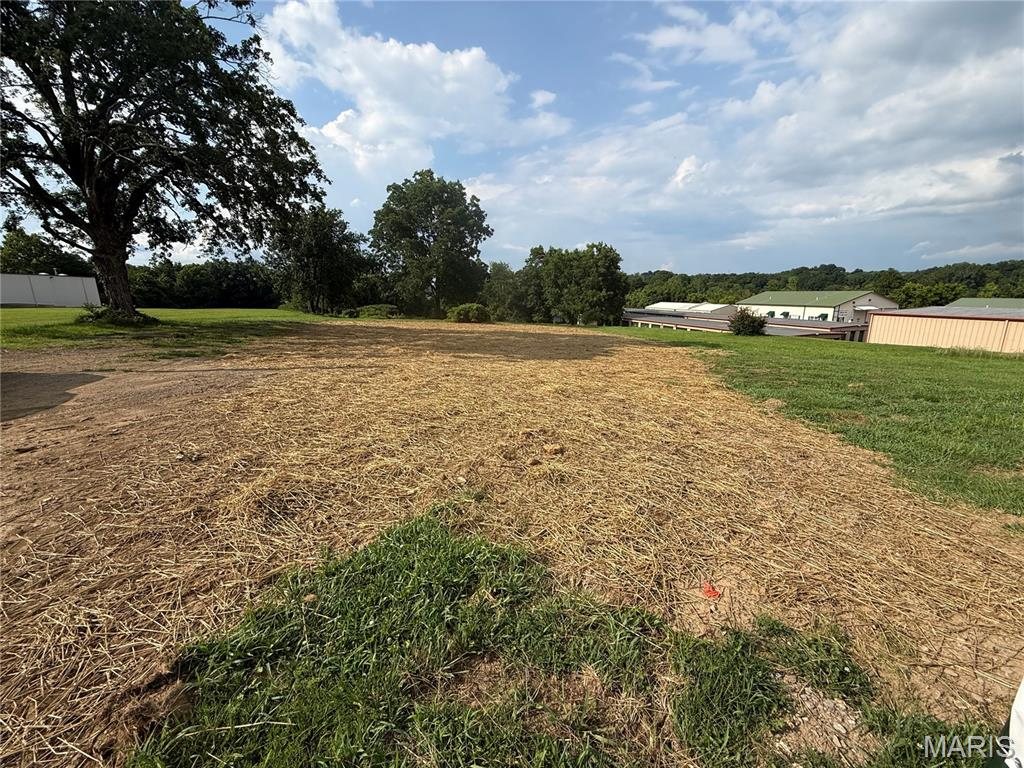 Ground-level view across the cleared site